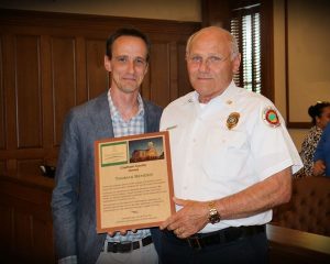 Photo of Fire Marshall Bender receiving recognition from the Chatham County Board of Commissioners. 