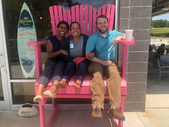 picture of me, Stephanie, and Darrell in a giant chair at lunch