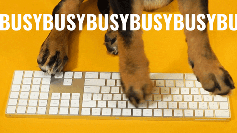 gif that says busy, busy, busy with puppy paws typing